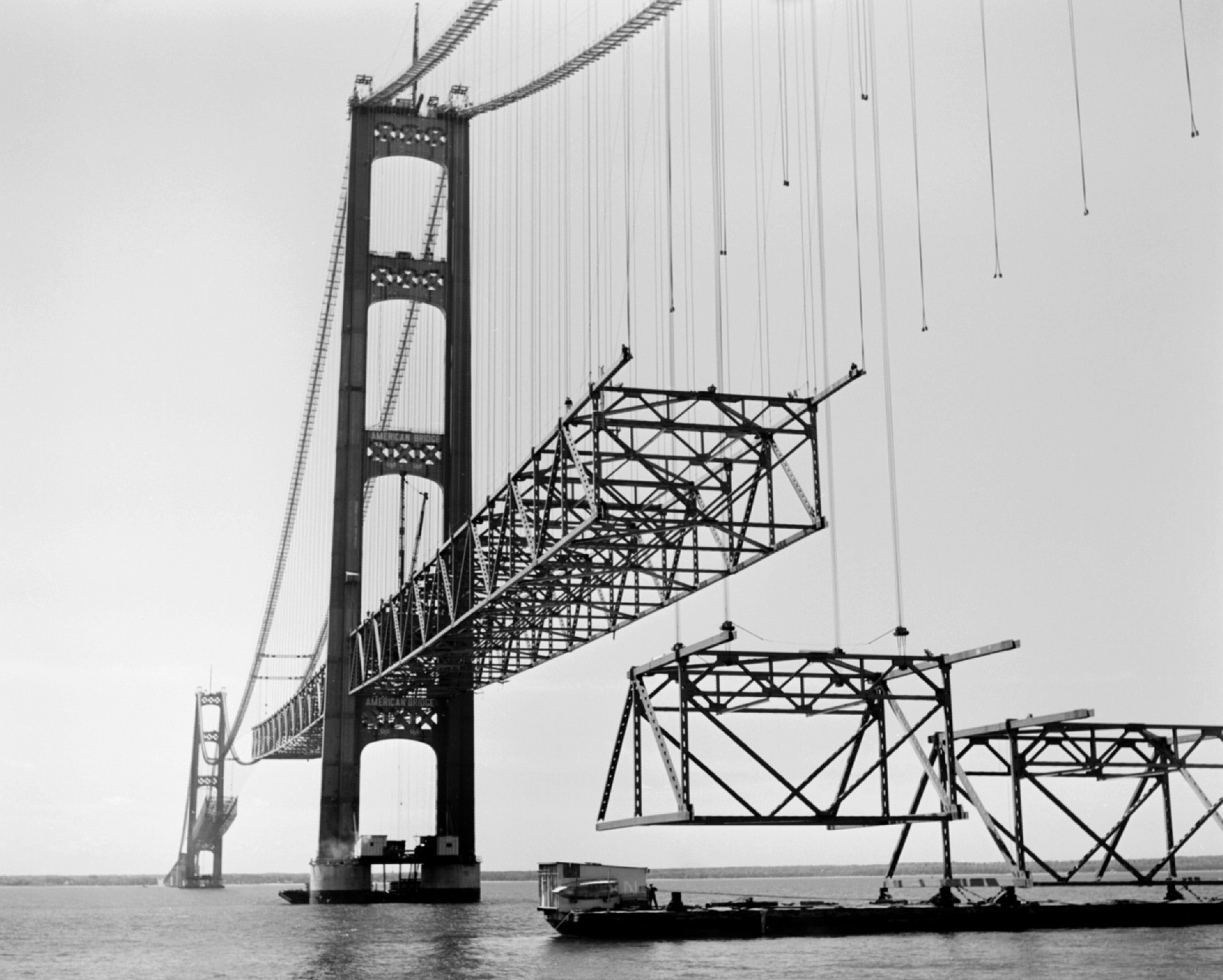 construction of a steel suspension bridge over water