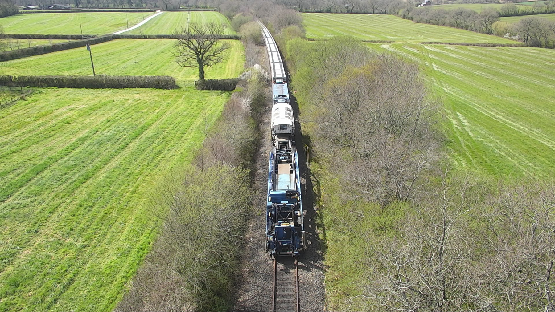 train on track moving through field