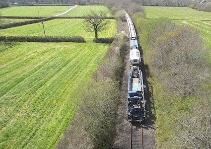 train on track moving through field