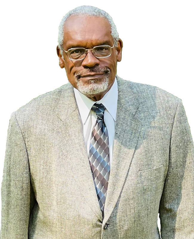 man in suit and tie smiling at the camera