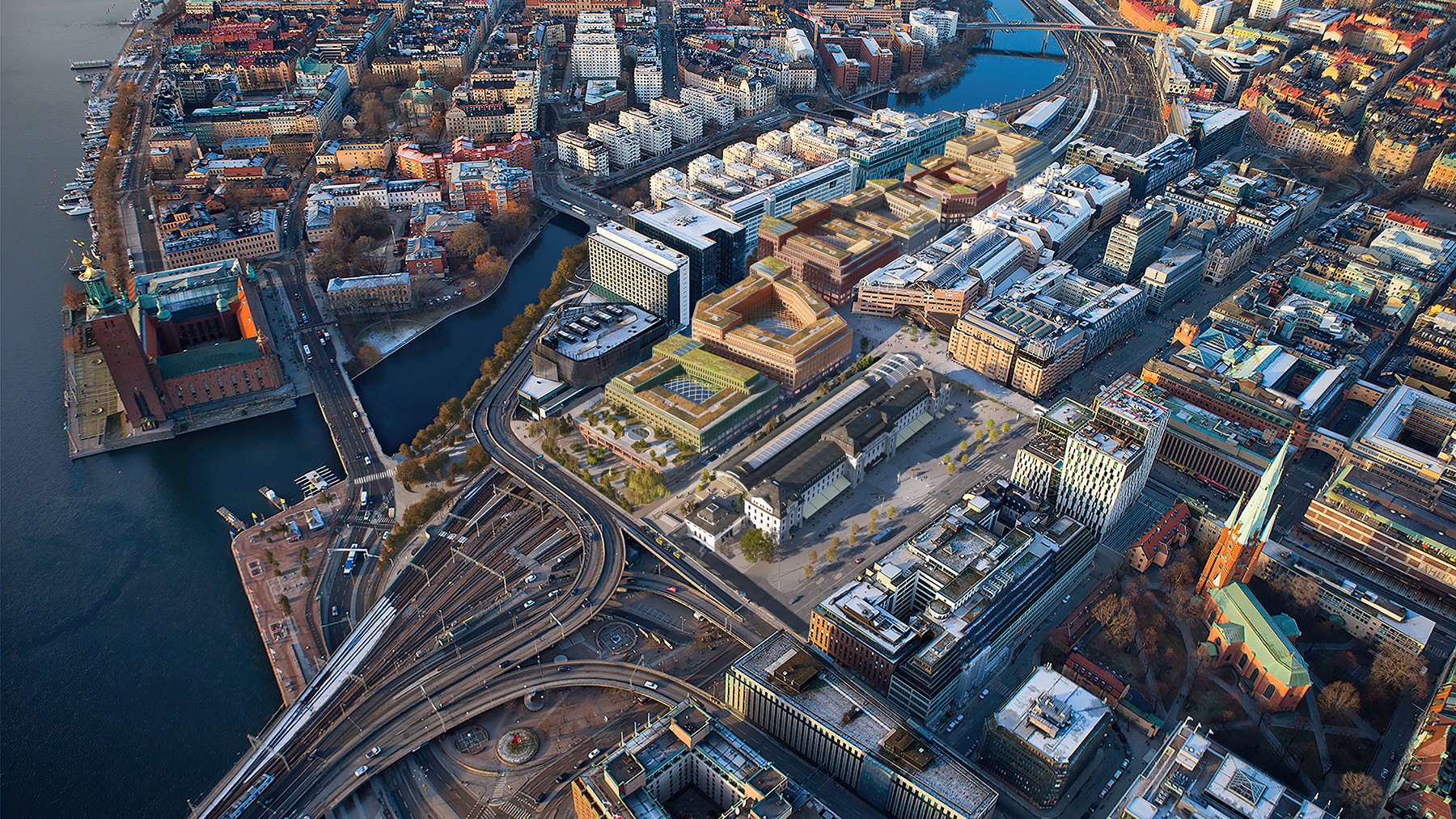AERIAL OF RAIL STATION AND TRACKS WITH PROPOSED BUILDINGS AND DECK