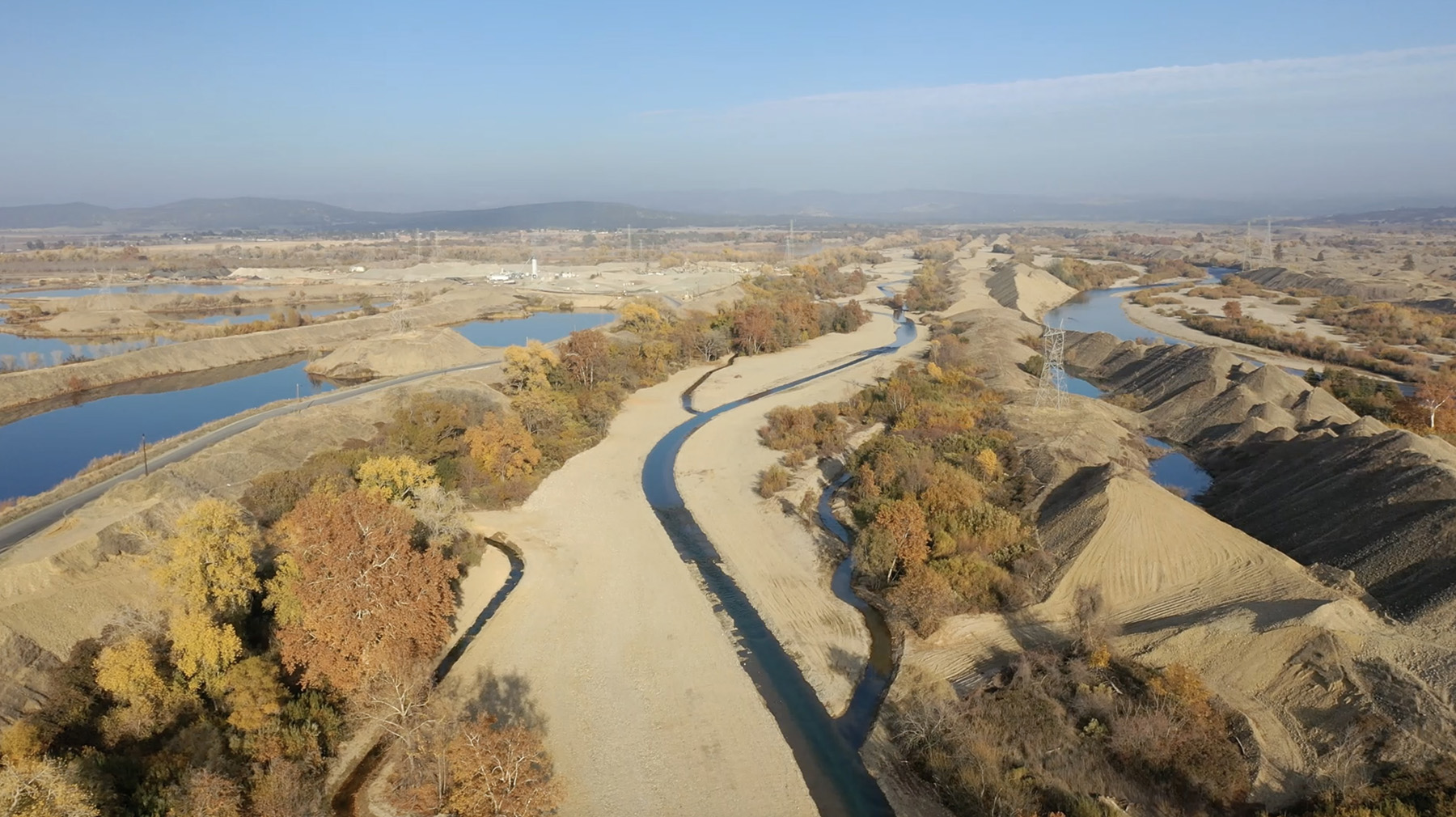 photograph showing land punctuated by meandering waterways