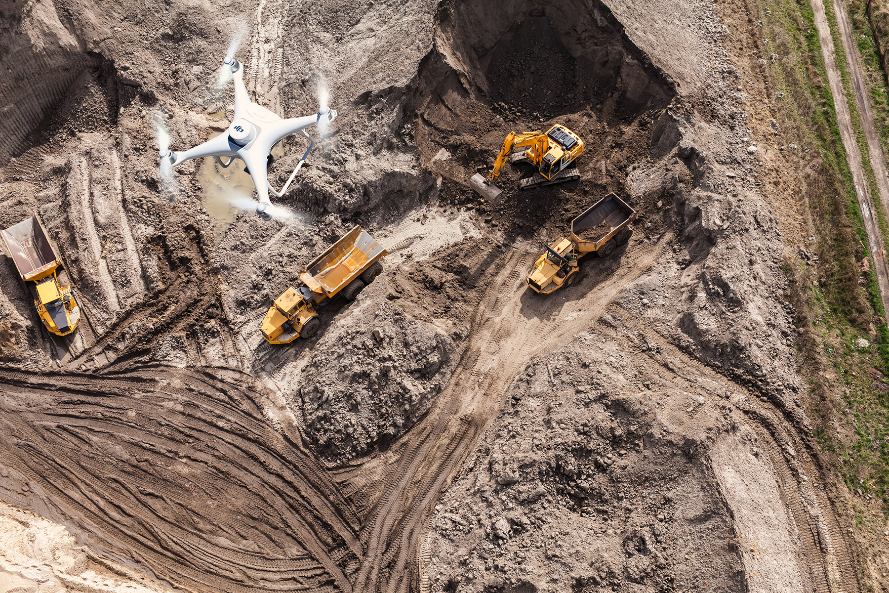 AERIAL OF TRUCKS AND DIRT