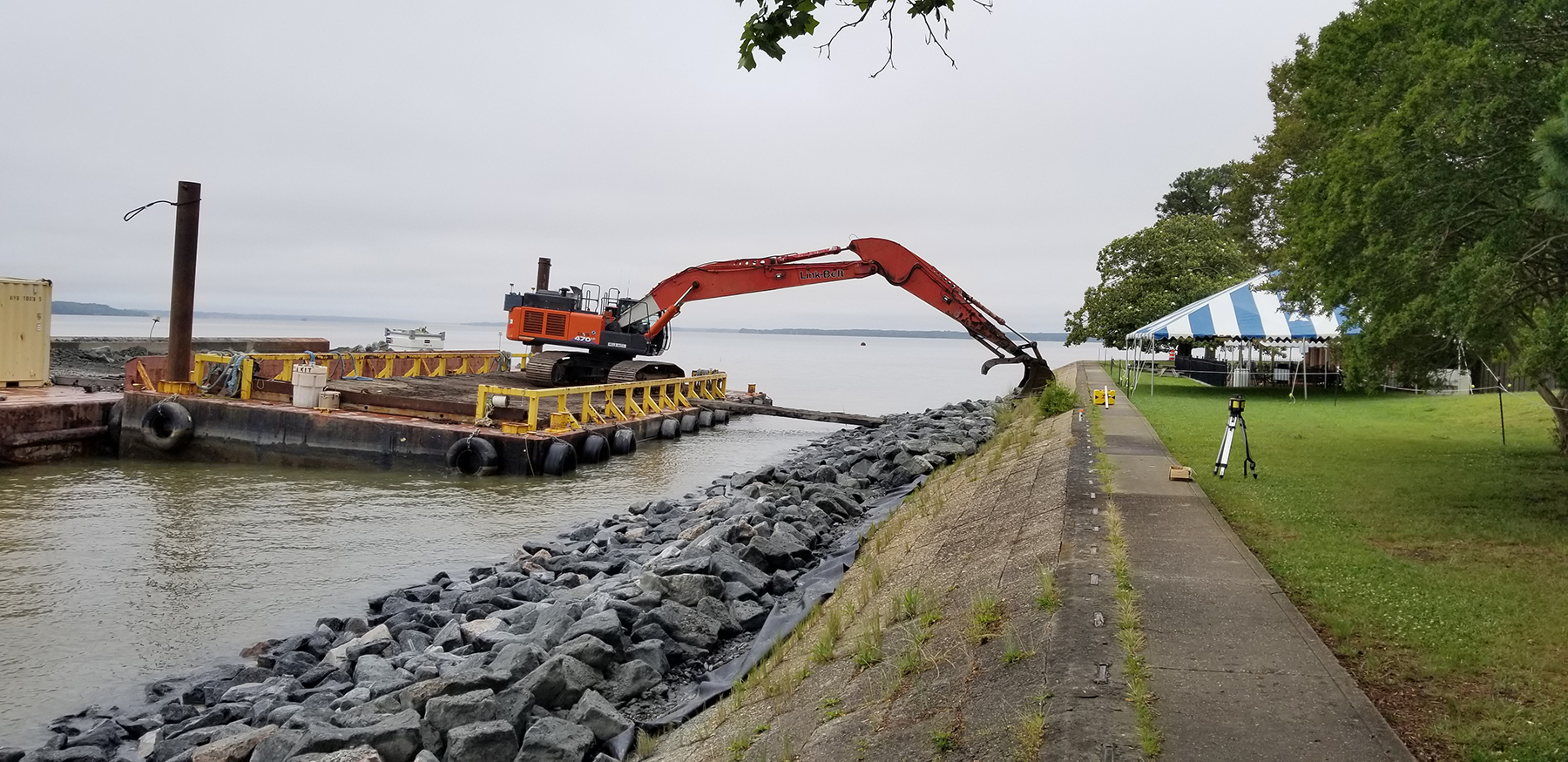 revetment being built against existing sea wall