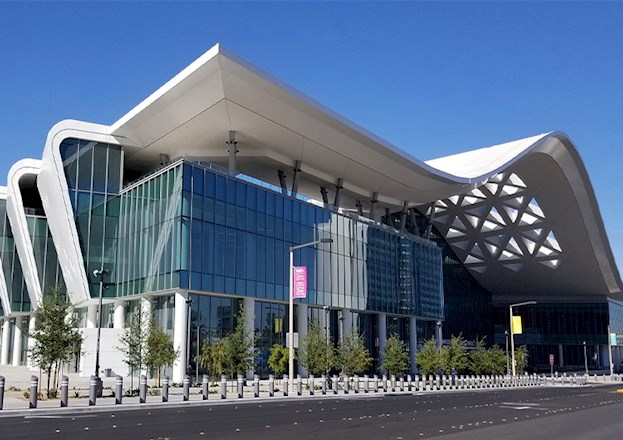 Exterior of a building with an undulating roof.