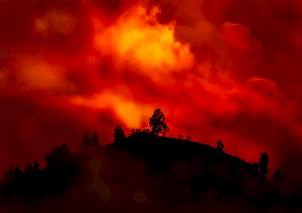 Landscape on fire at night.