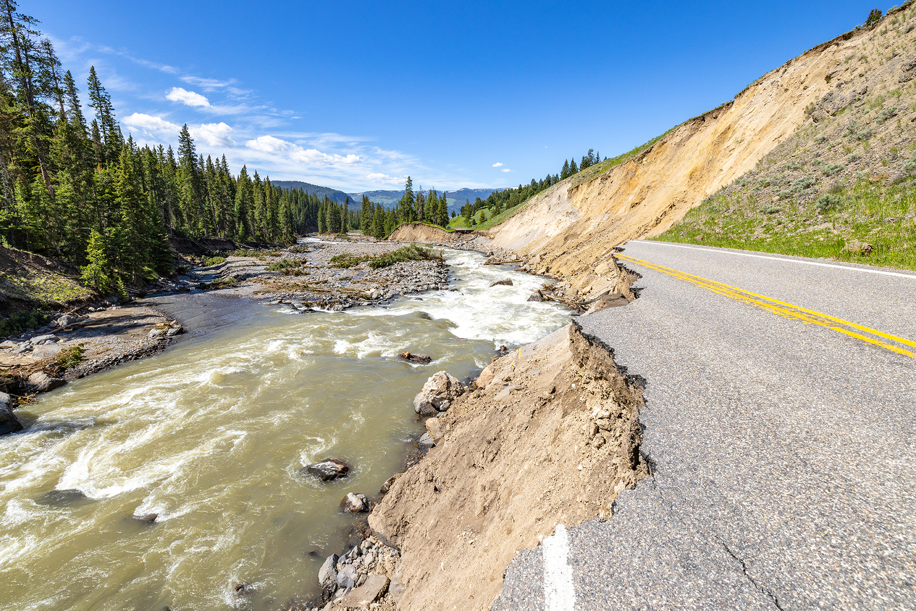 Floodwaters damaged Yellowstone’s Northeast Entrance Road in multiple locations, including this section near the Trout Lake trailhead. (Photograph courtesy of NPS / Jacob W. Frank)
