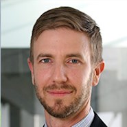 man in jacket, shirt, and tie