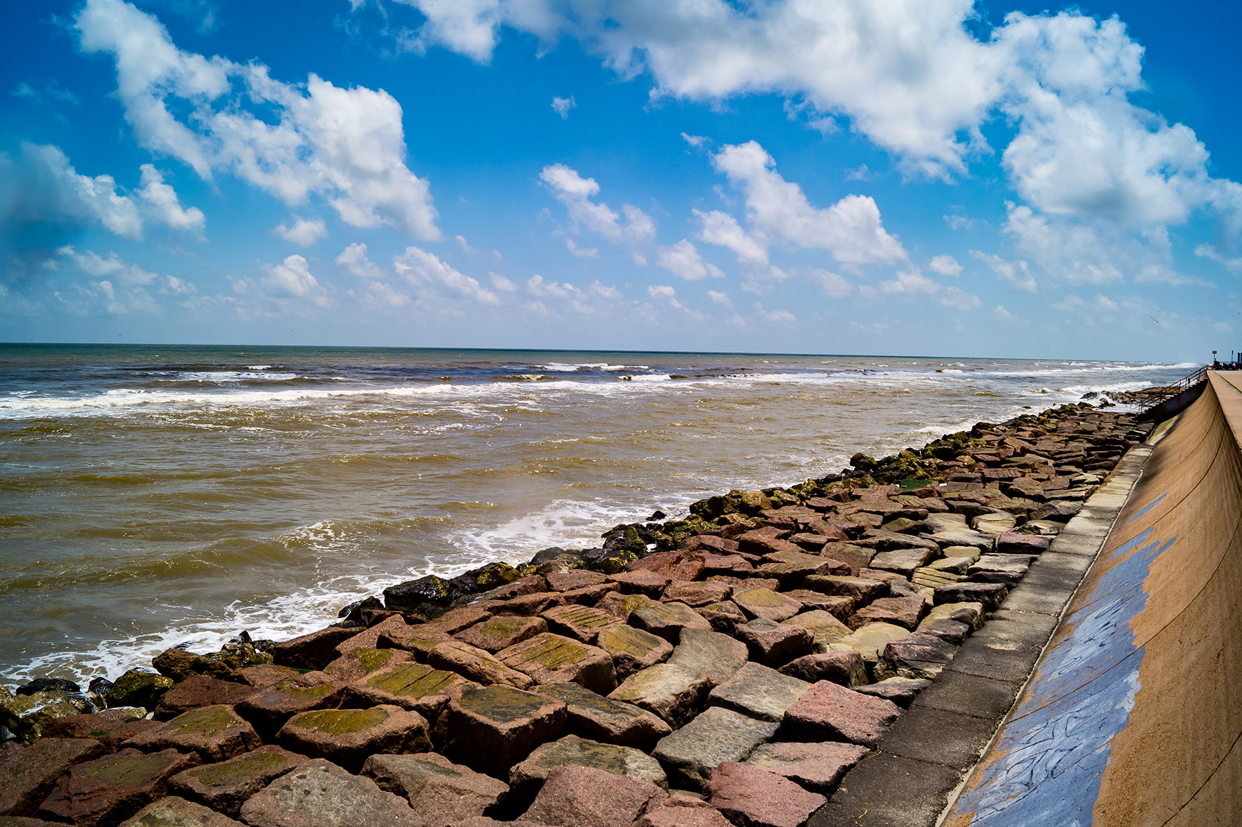 Irregular shaped rocks act as a seawall to protect communities from flooding and storm surges