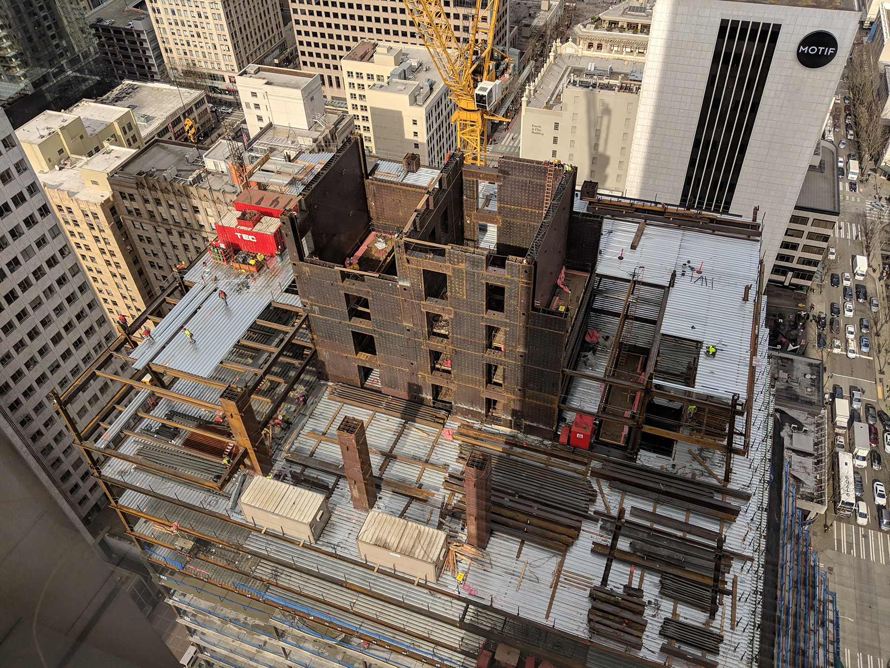 photo shows a building with a concrete-filled, composite steel-plate shear wall core system being erected