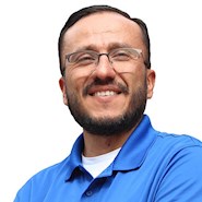 man in blue shirt with white writing