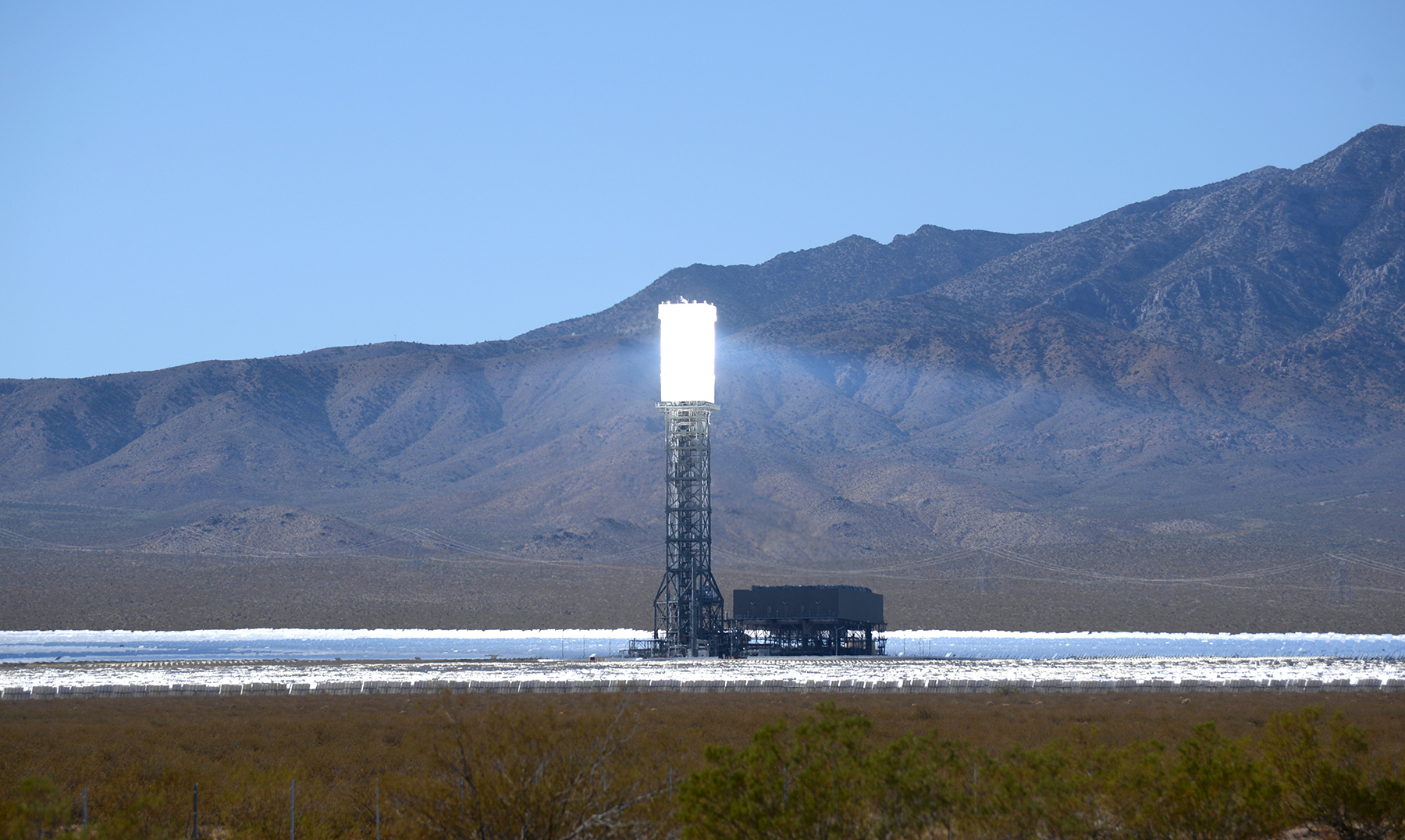 The Ivanpah Solar Power Facility is a concentrated solar-thermal plant in the Mojave Desert near the California-Nevada border. Acres of heliostat mirrors direct sunlight onto receivers located in the three centralized solar towers. The receivers generate steam to drive turbines and generate power. When it opened in 2014, Ivanpah was the world's largest solar-thermal power station. In 2019 it produced 772,214 MWh of electricity. (Photo by Laura Ockel on Unsplash)