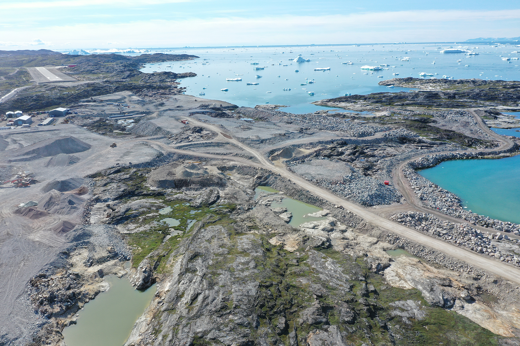 In both Nuuk and Ilulissat, shown here, 6 million cu m of rock require blasting to create level surfaces for the airport facilities. (Photograph courtesy of Kalaallit Airports)