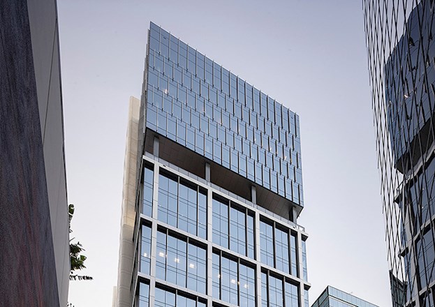 A high-rise building in a city block.