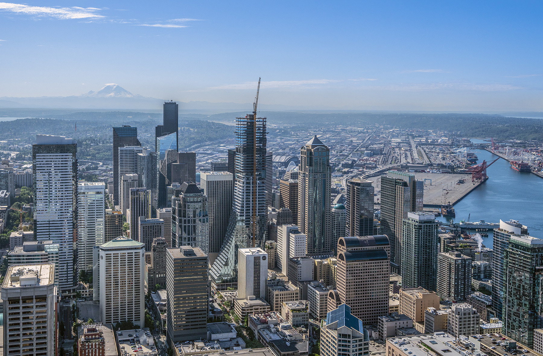 A cityscape is shown. A skyscraper is being erected in the photo. 