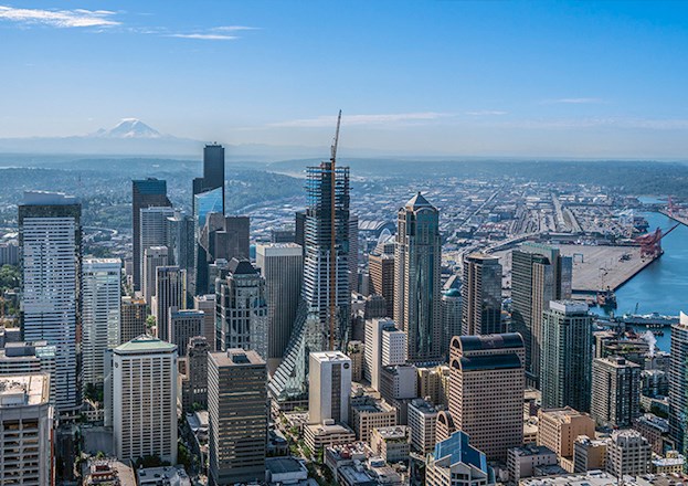 A cityscape is shown. A skyscraper is being erected in the photo.