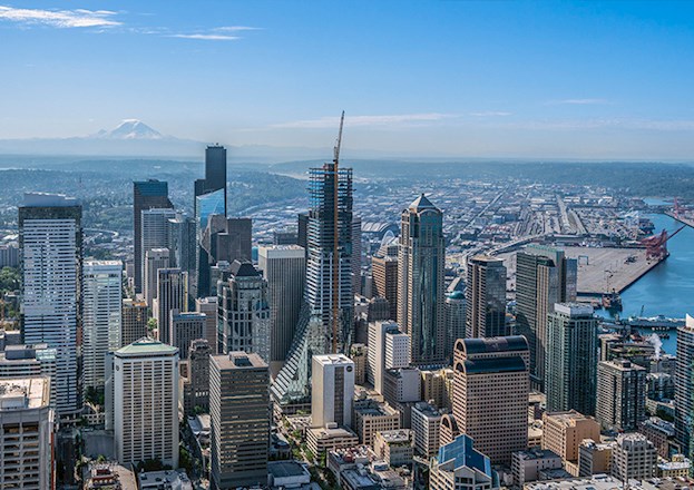 A cityscape is shown. A skyscraper is being erected in the photo. 