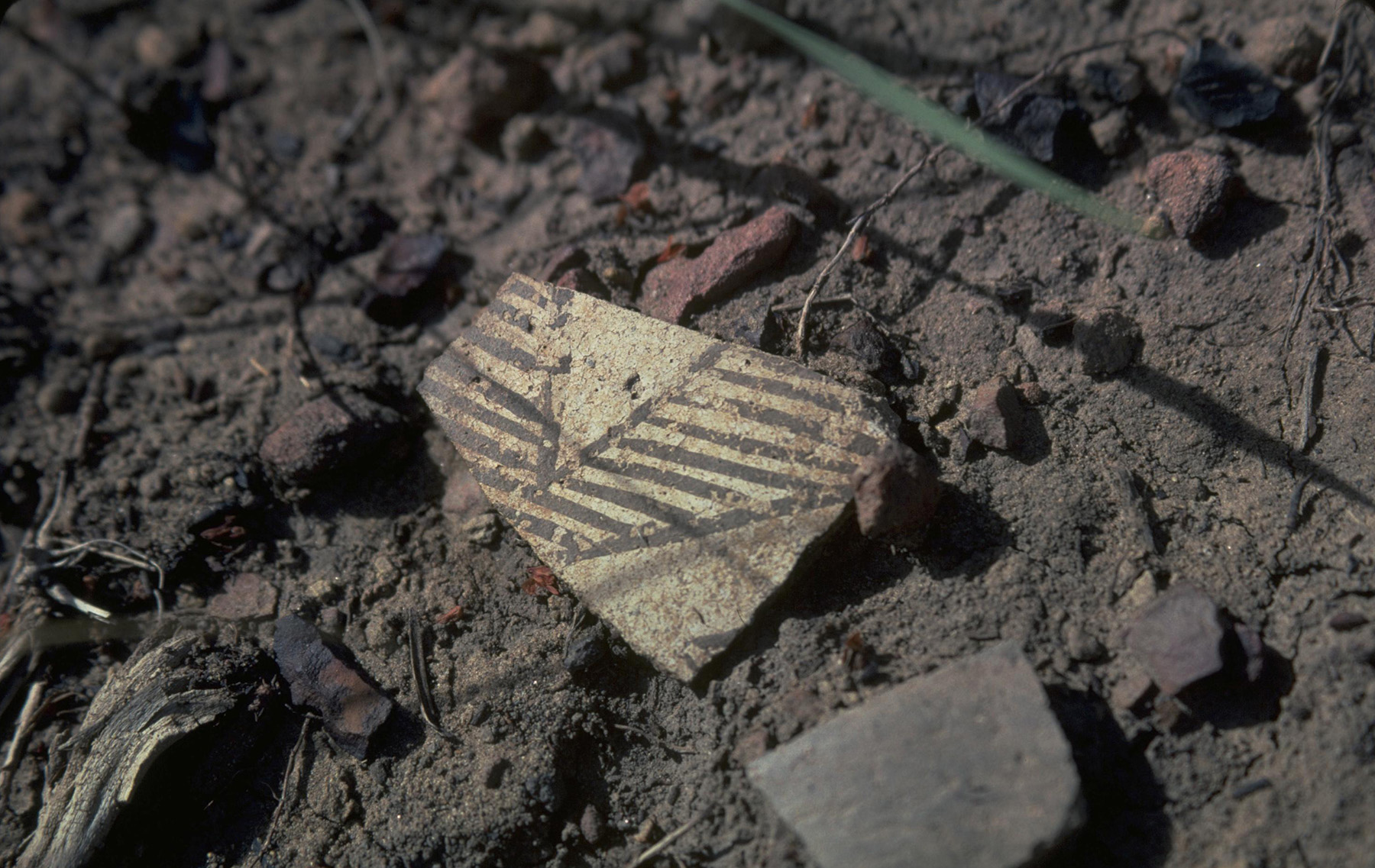 piece of pottery used to carry water sitting on the ground