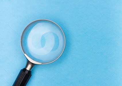 magnifying glass on a blue background