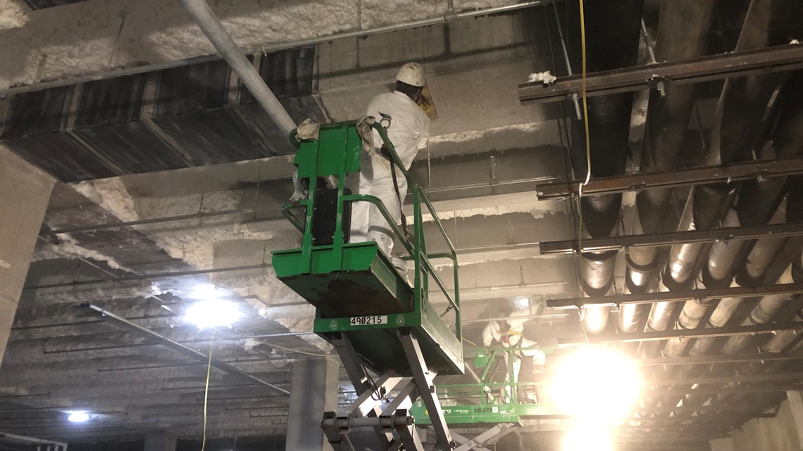 The reinforced-concrete beams in the parking garage beneath the exhibit space were wrapped with a fiber-reinforced polymer system. Additional structural steel supports were also installed to strengthen the floor. (Image courtesy of Fyfe FRP)