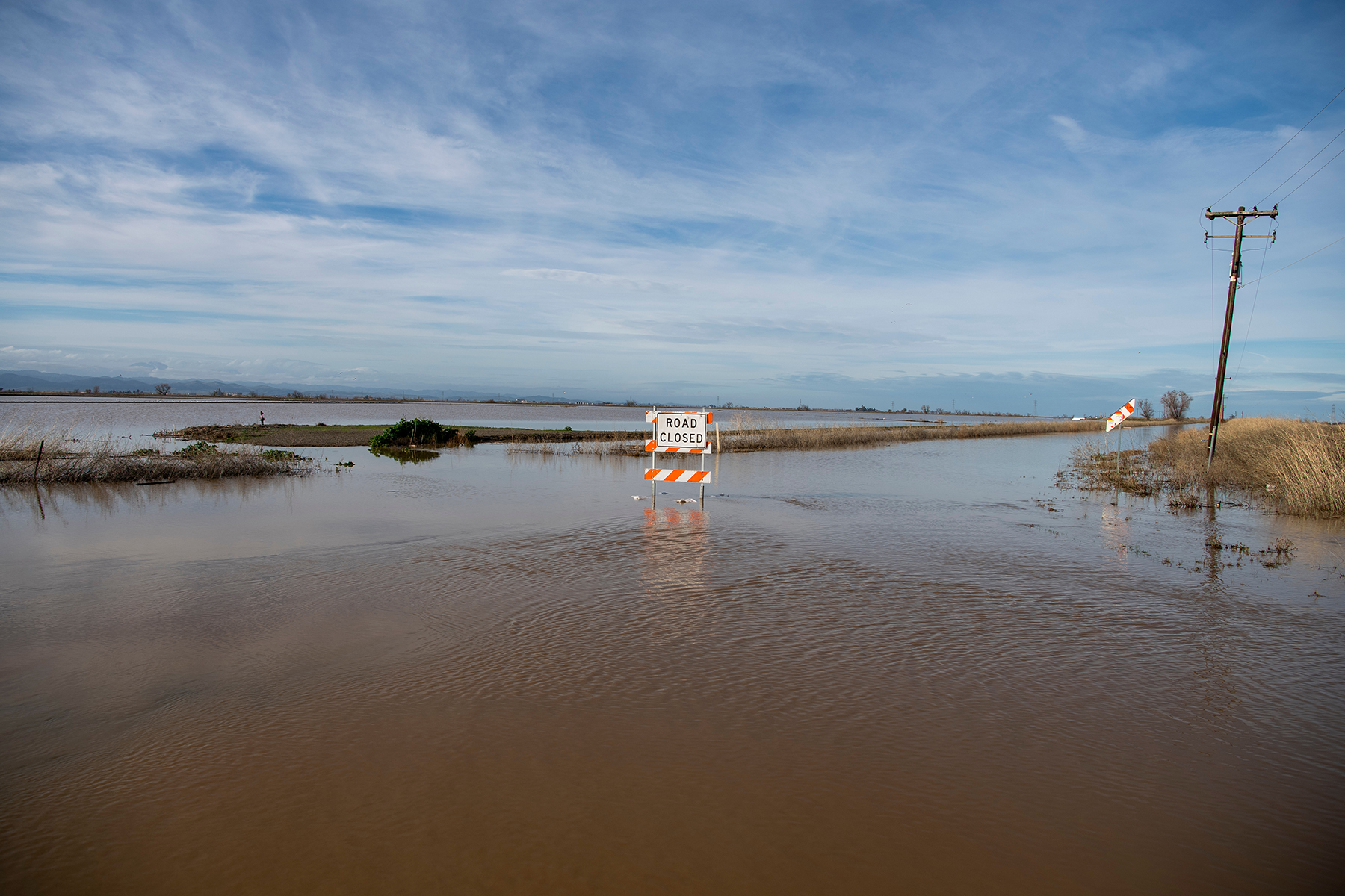 Floodwaters forced the closure of San Jose Road at the intersection of State Highway 20 near Williams, in Colusa County, California. (Image courtesy of Kenneth James/California Department of Water Resources)