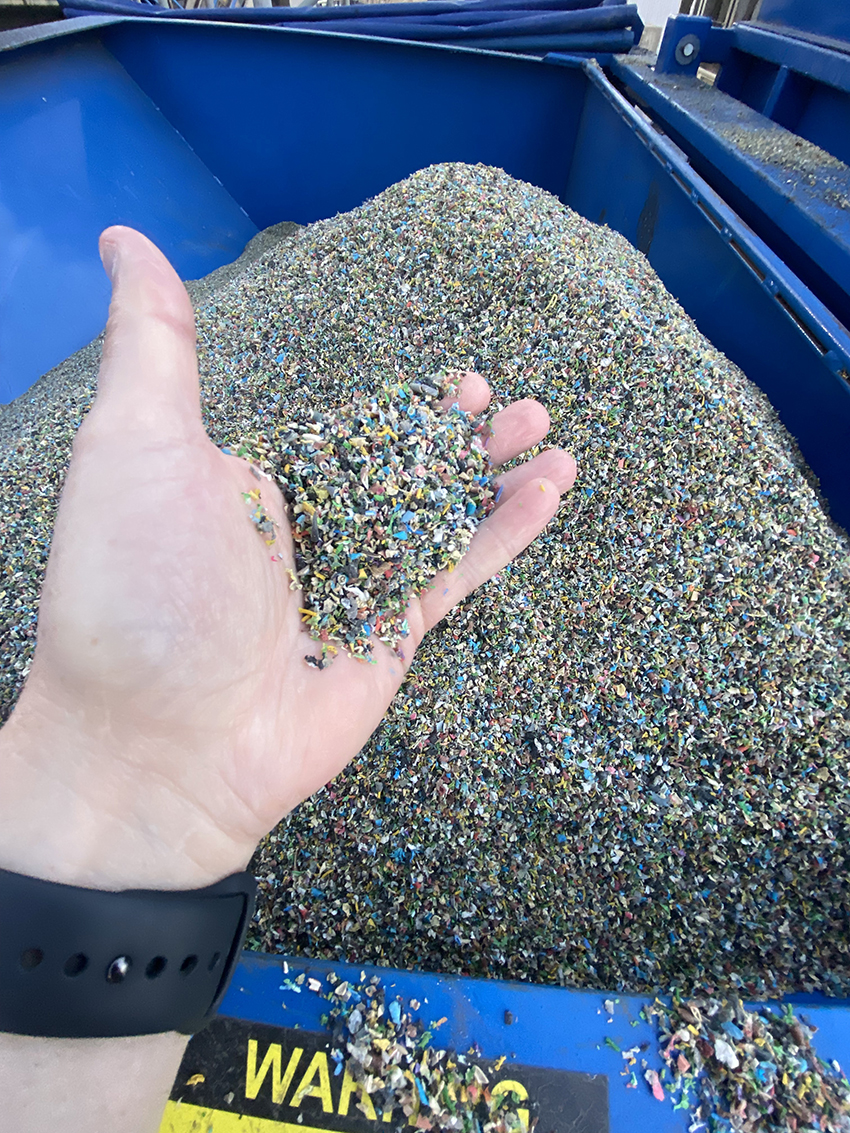 Scotland-based MacRebur is turning waste plastic pieces, like the ones shown here, into an asphalt additive that replaces a portion of the bitumen binder used in conventional asphalt. (Image courtesy of Rutgers Asphalt Pavement Laboratory)