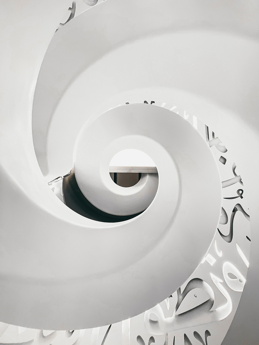 A spiral staircase as seen from looking up from the floor. 