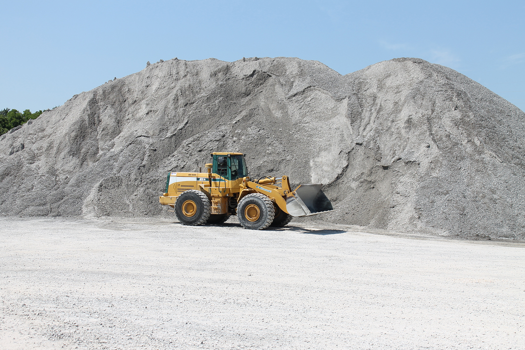 Piles of sand can act as energy storage in underground gravity energy storage. The sand would wait on the surface at a repurposed mine until it was lowered down a shaft in containers, producing energy along the descent. (Image courtesy of PxHere)