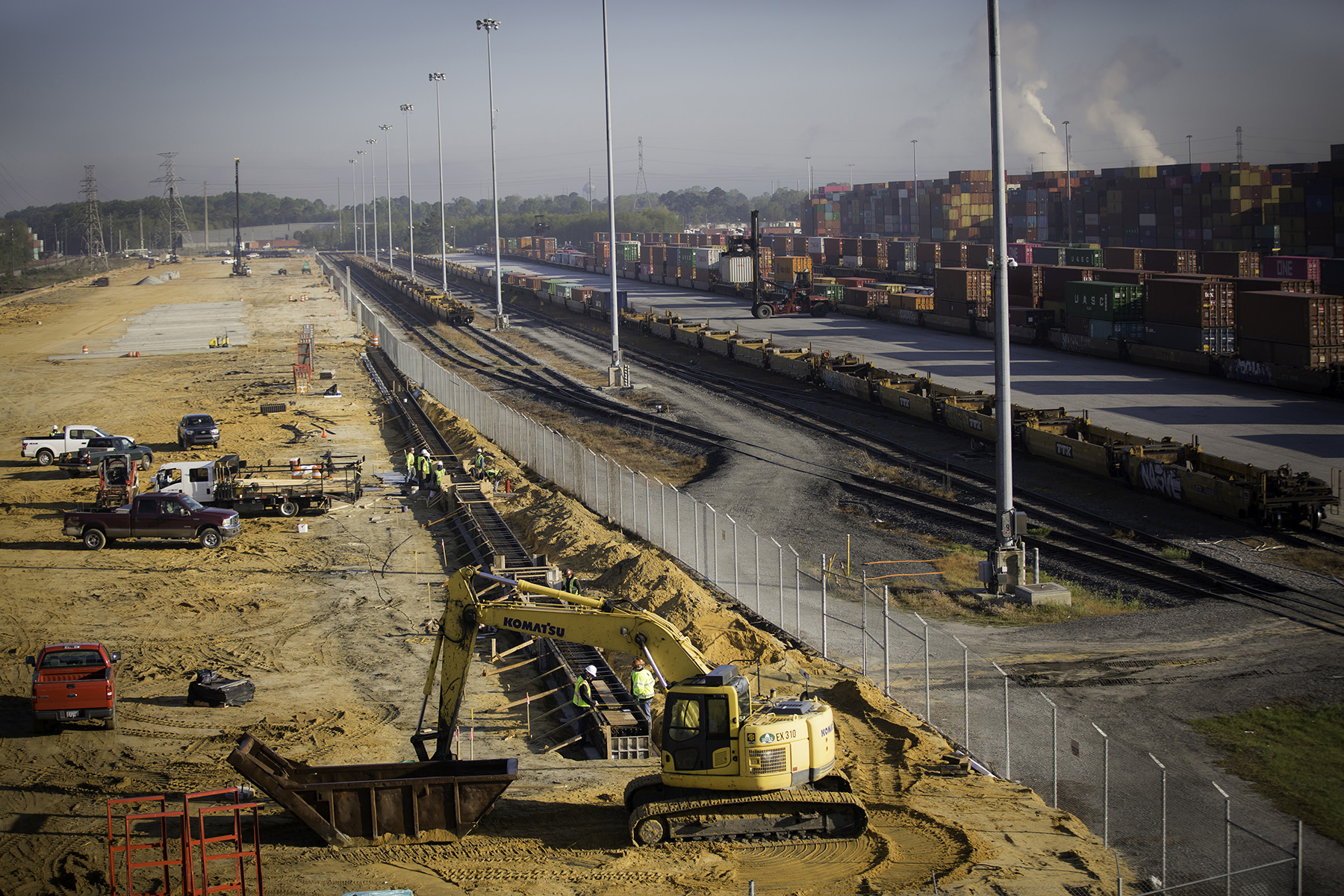 Photo shows construction operations at a new rail yard.