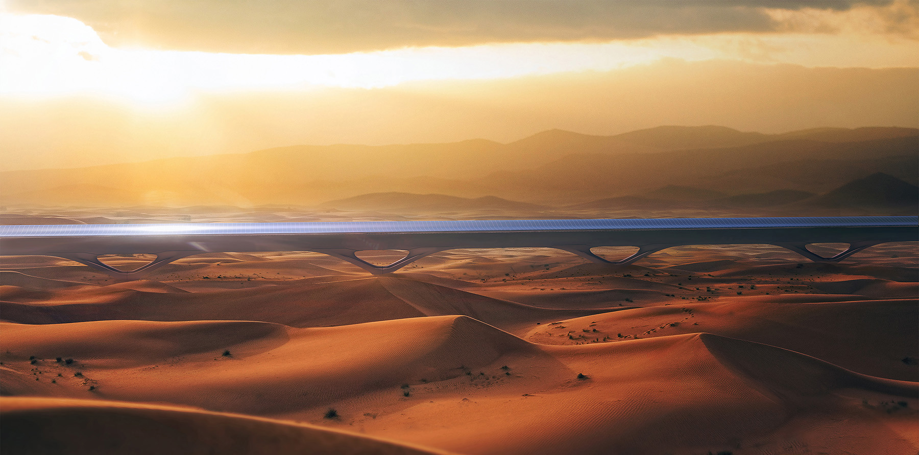 Desert scene with sand and sparse vegetation. There is a train track set in the landscape.