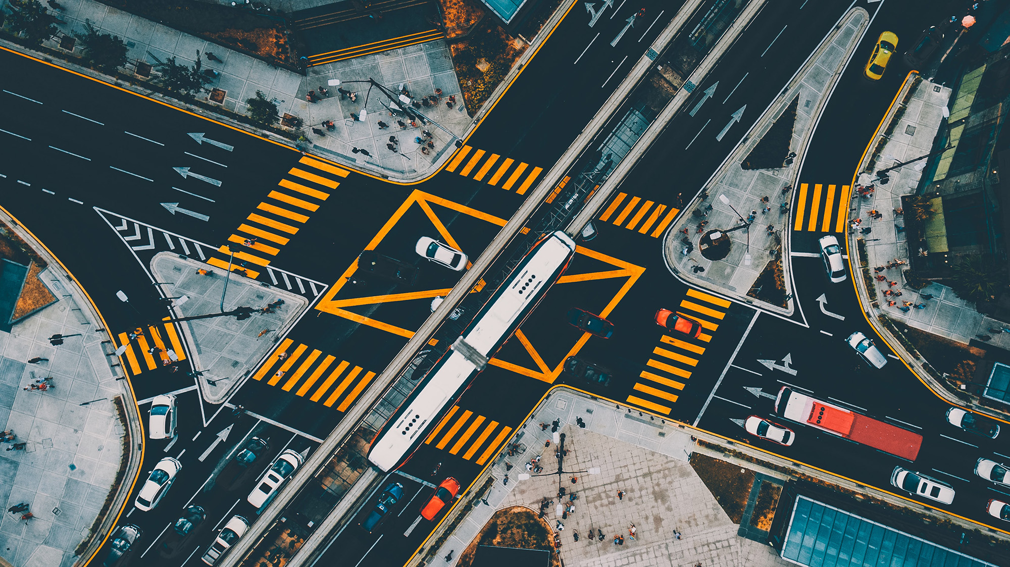 Image shows buses, trains, cars.