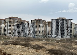 The Earthquake Engineering Research Institute's Buildings Reconnaissance Team regularly noted similar buildings in the same vicinity that fared differently in the earthquakes. Here, in the town of Malatya, Turkey, one of two high-rise apartment buildings collapsed, while the other remained standing. (Image courtesy of Halil Sezen)