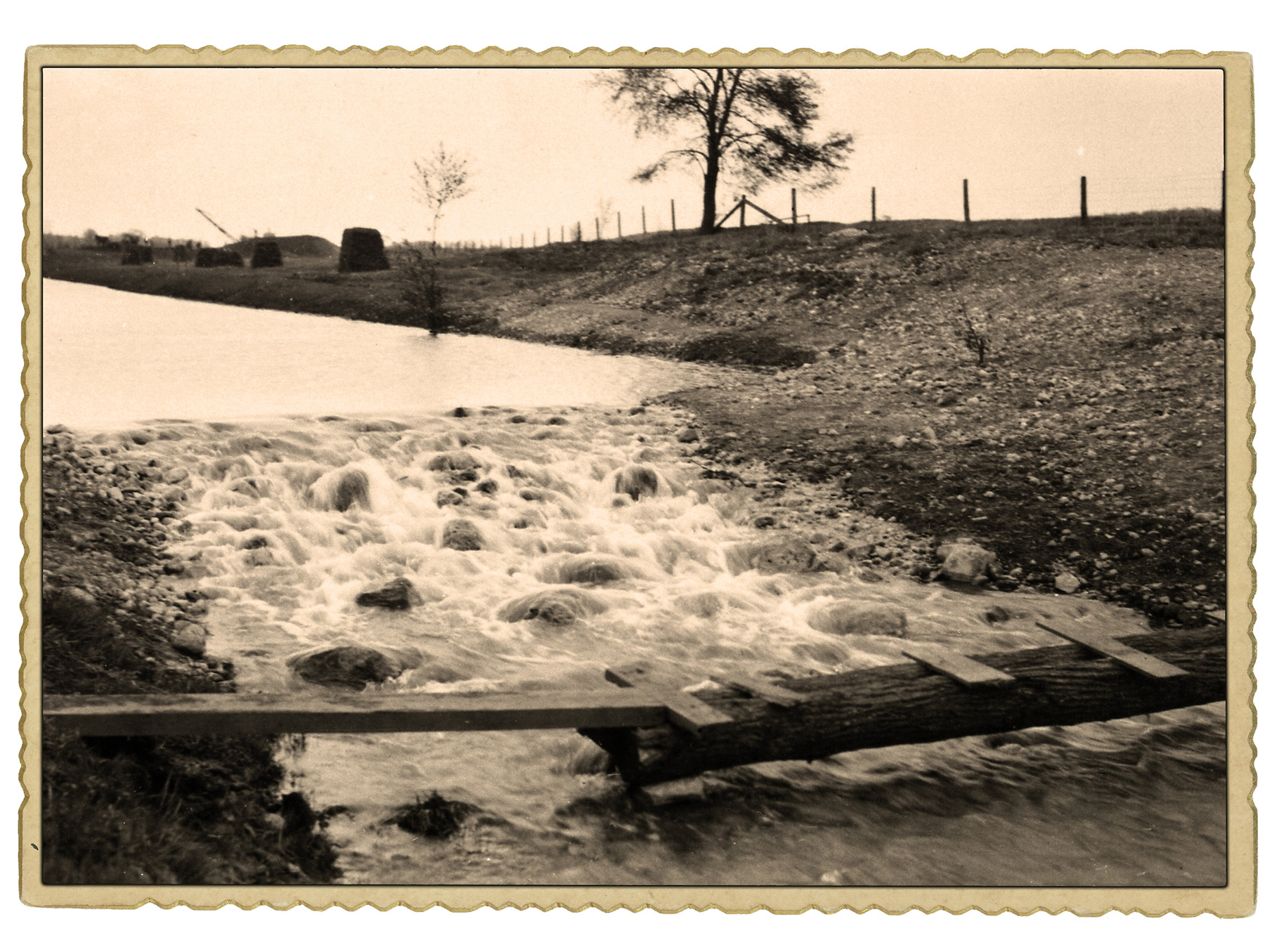 Historical photo shows water running over rocks.