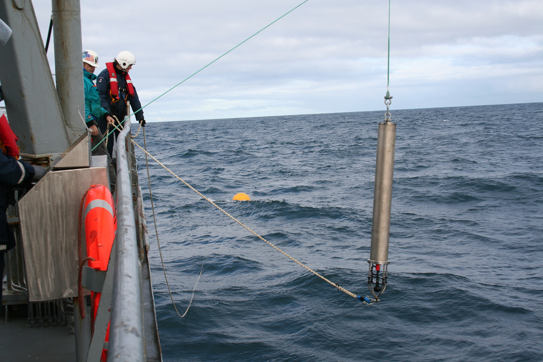 Hydrophones, like this one being lowered into the North Atlantic Ocean, listen to ocean sounds like whale songs or underwater explosions. New research recommends using hydrophones to listen for earthquake sounds to help with tsunami warnings. (Dave Mellinger/Oregon State University, Wikimedia)