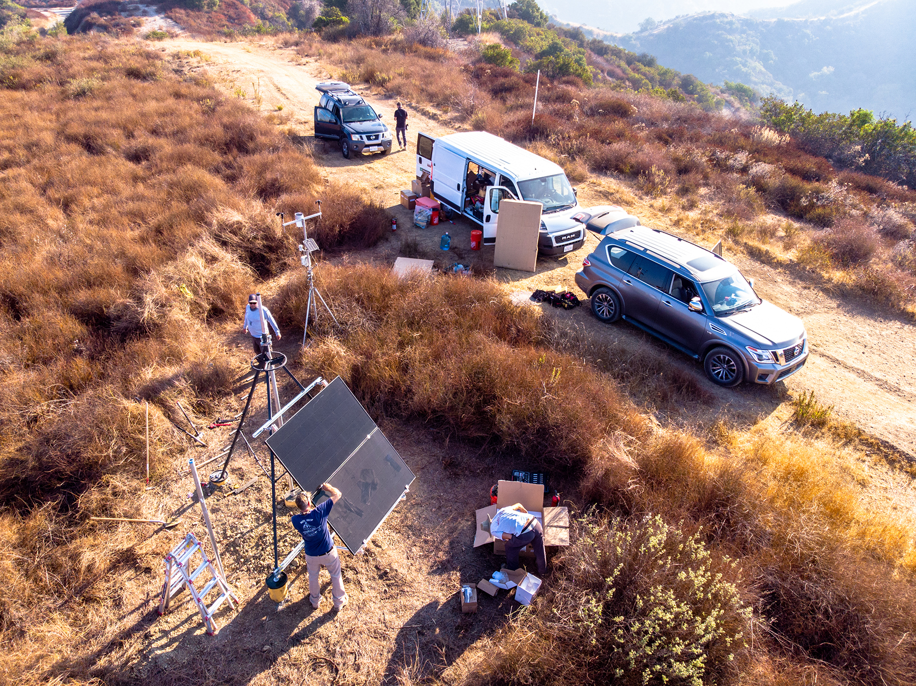 Crews install a temporary camera tripod platform for the ALERTCalifornia system near Santa Monica, California. These small, temporary platforms are easily erected and can be removed seasonally, minimizing untoward effects on sensitive habitats and sacred tribal lands. (Image courtesy of ALERTCalifornia UC San Diego)