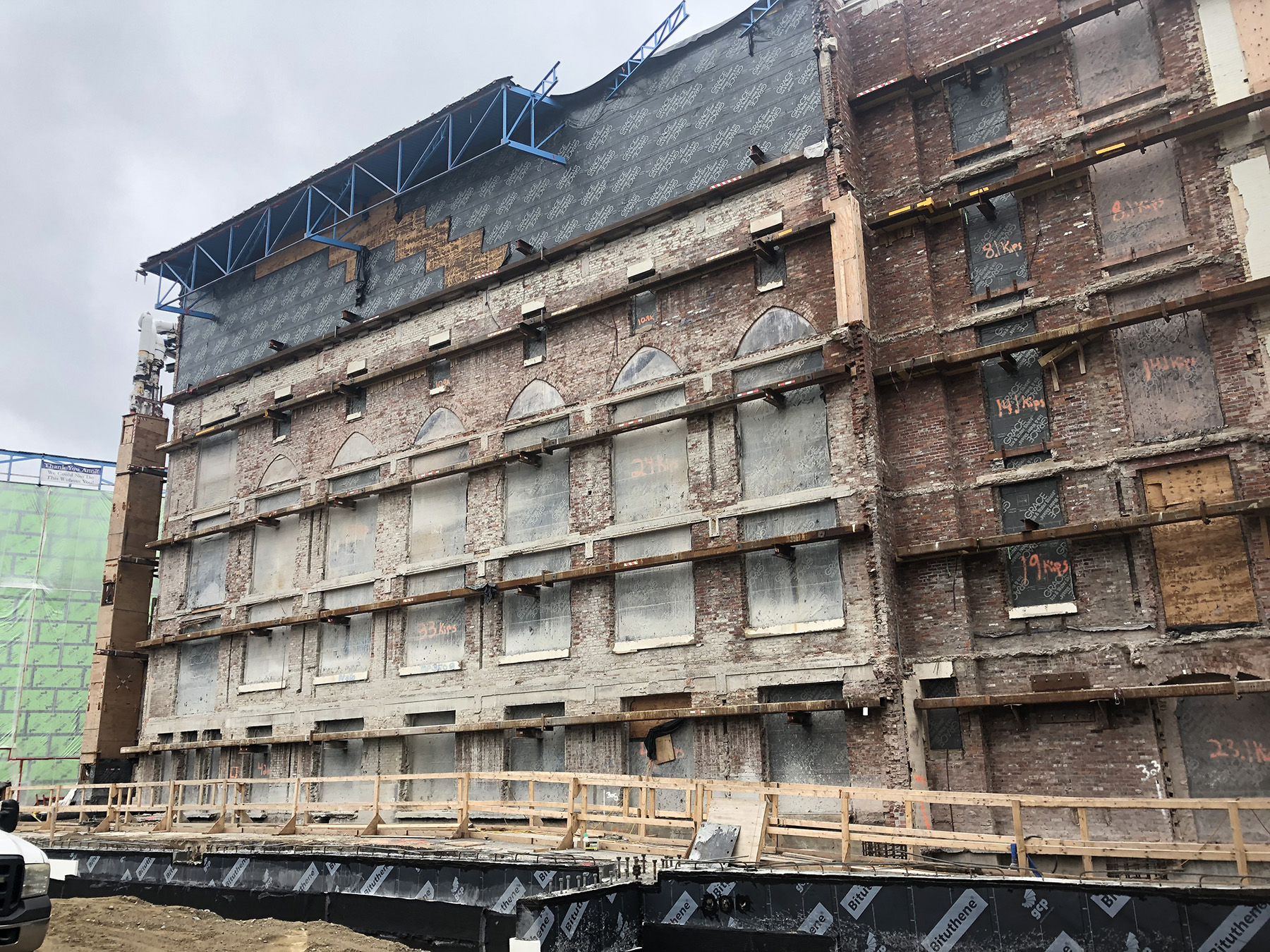 A multistory facade wall is shown. The building once attached to it has been demolished.