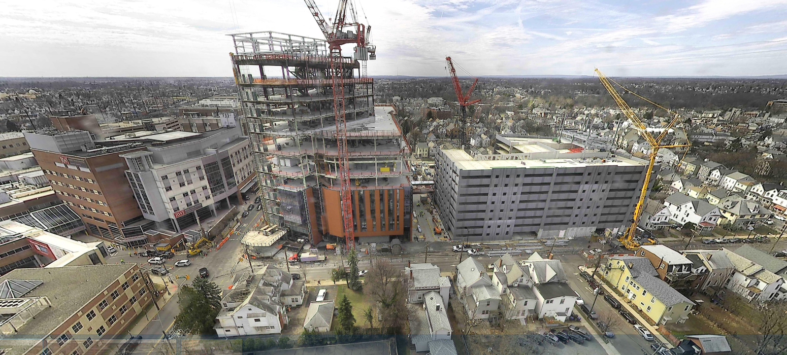 The Jack and Sheryl Morris Cancer Center is scheduled to open in late 2024. The 12-story facility will be connected via pedestrian bridges to the nearby Rutgers Cancer Institute of New Jersey and a parking garage. (Photograph courtesy DEVCO and Joseph Jingoli & Son Inc.)