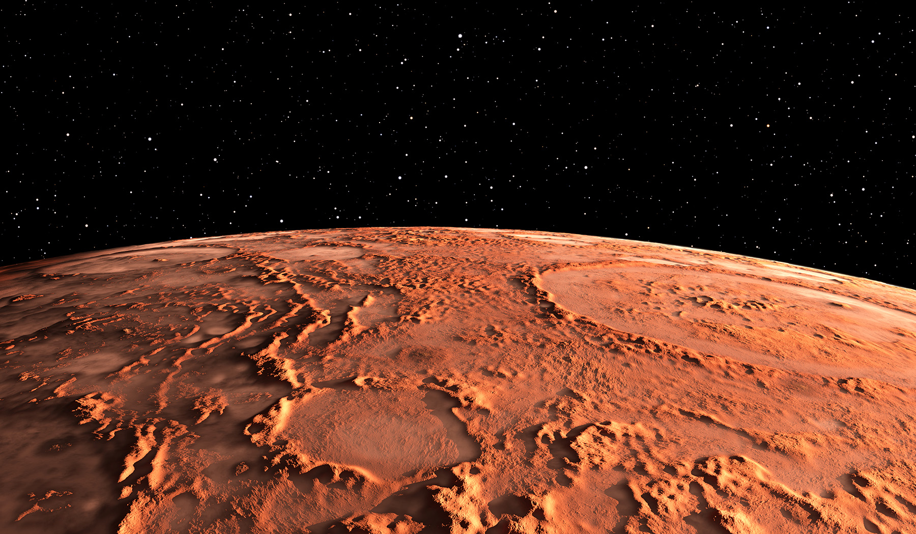 Photograph shows the surface of Mars with canyons, volcanoes, and polar ice caps. 