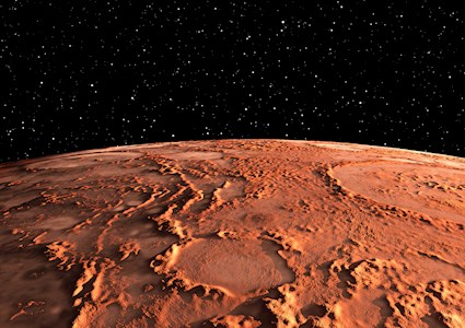 Photograph shows the surface of Mars with canyons, volcanos, and polar ice caps. 