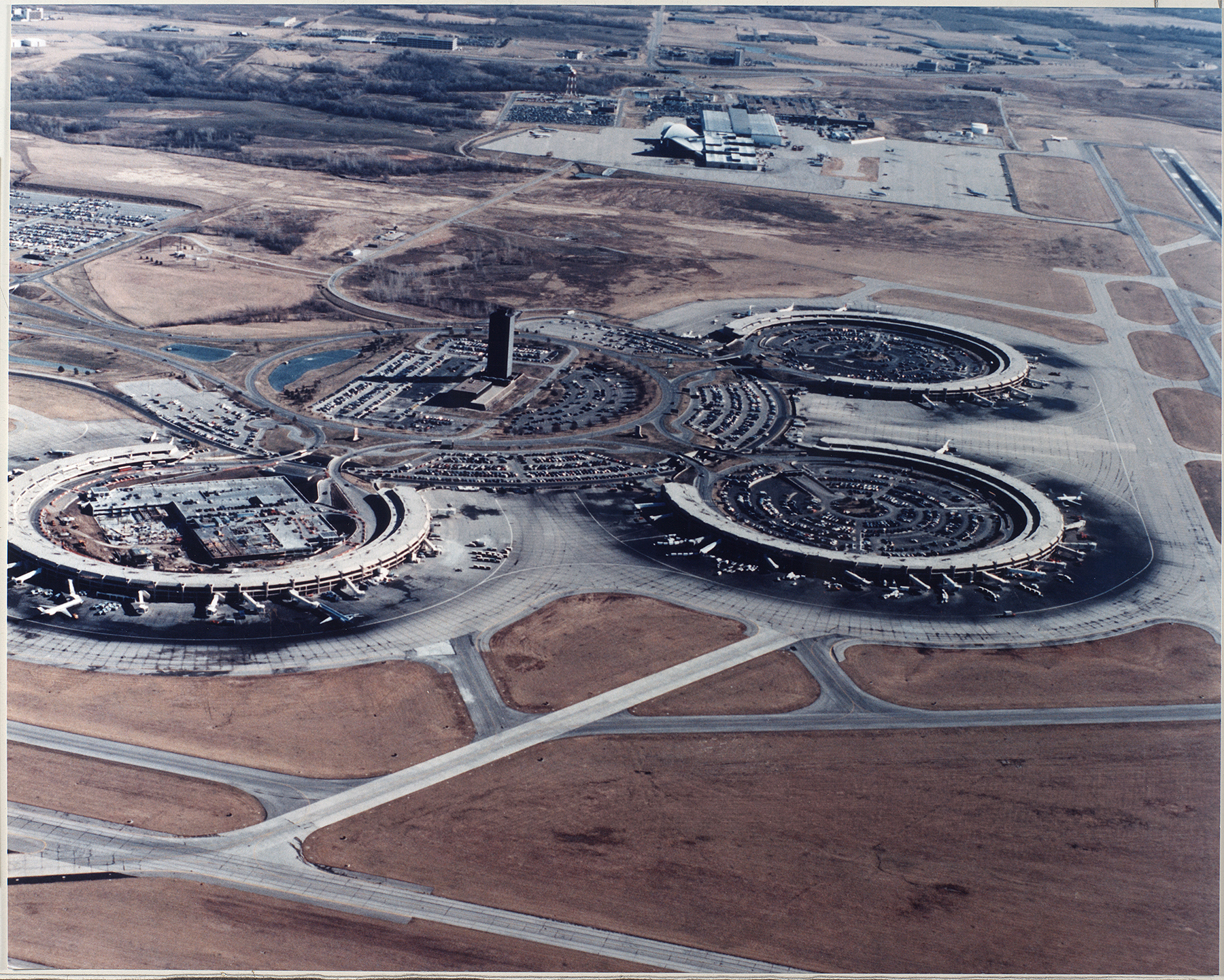 An aerial view of Kansas City International Airport with the original three terminals and control tower in view as well as part of the runways. (Image courtesy of Missouri Valley Special Collections, Kansas City Public Library, Kansas City, Missouri) 