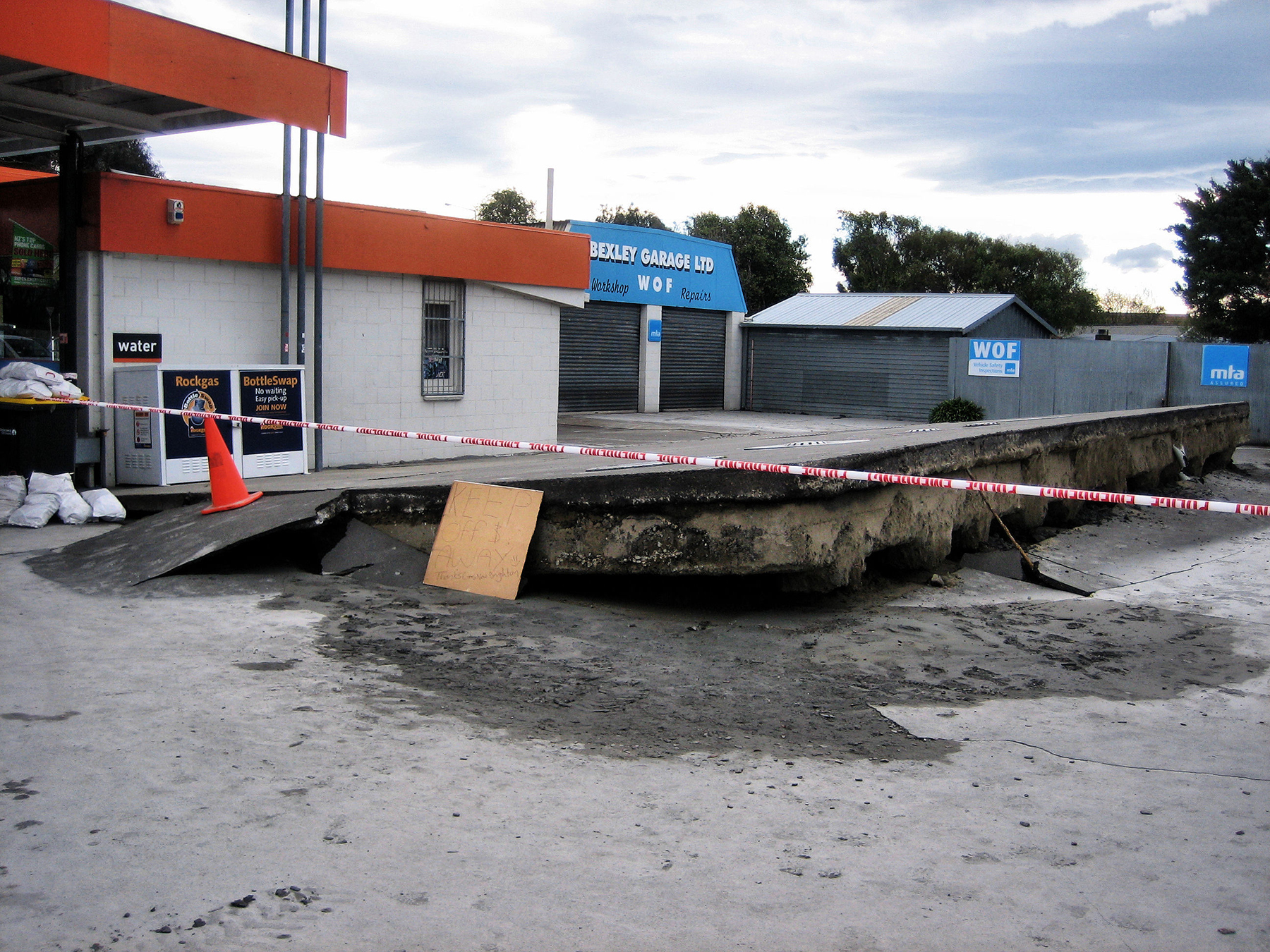 After the 2010 earthquake near Christchurch, New Zealand, liquefaction occurred throughout the city, including at this gas station. (Image courtesy of Martin Luff) 