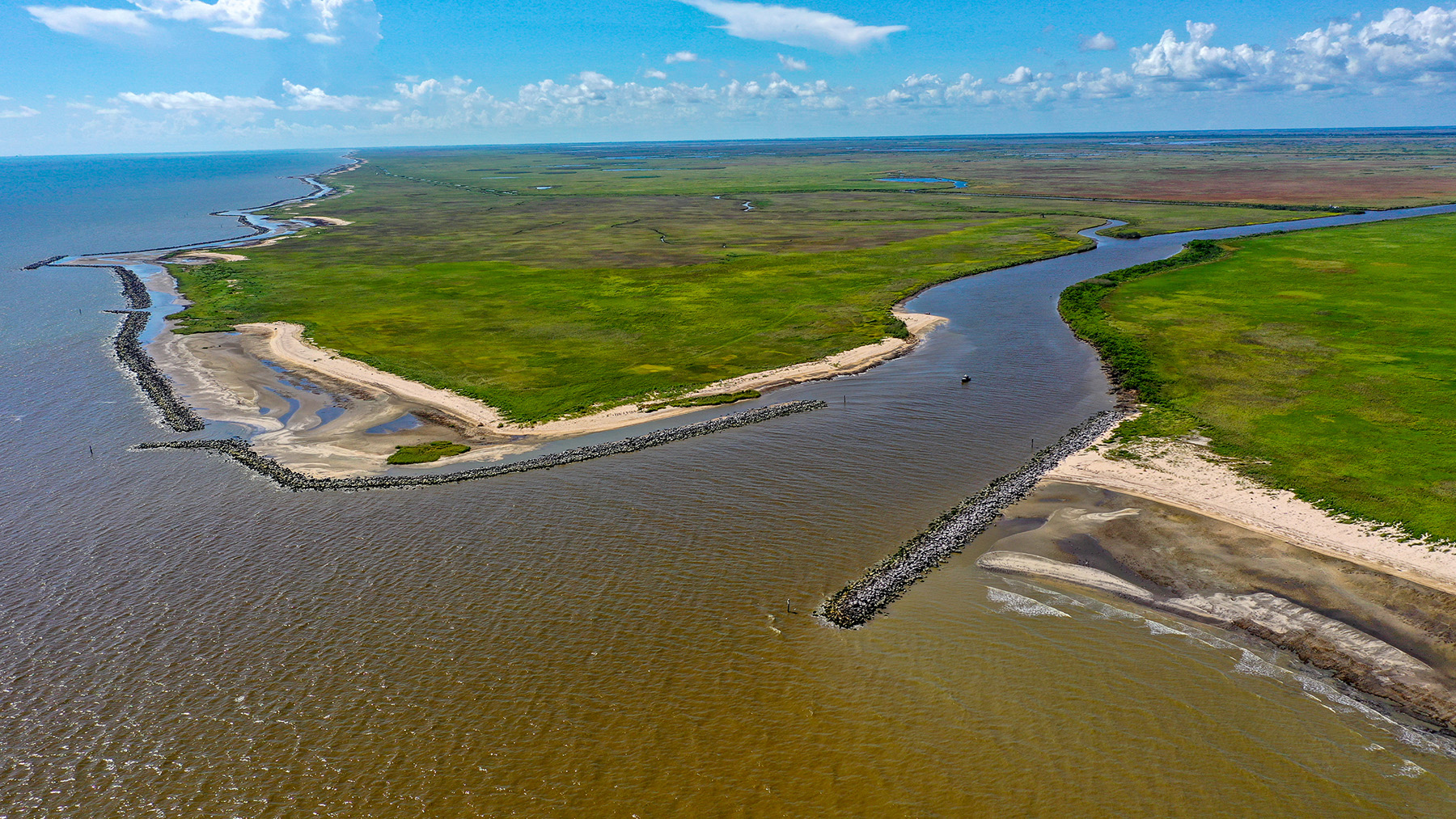 Image shows an irregularly shaped land mass surrounded by water on two sides. 