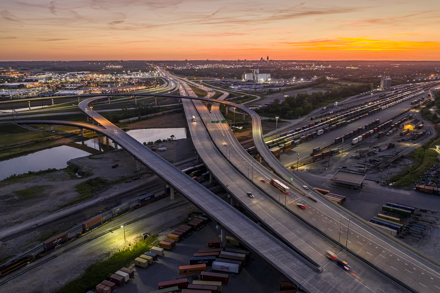 Image shows an intricate, multilane roadway system at night. 