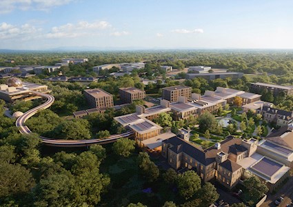 AERIAL OF A CAMPUS NESTLED AMONG TREES, WITH AN ELEVATED WALKWAY (Image courtesy Foster + Partners)
