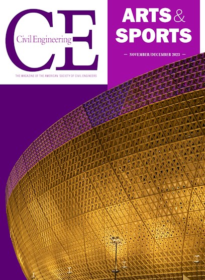 A large, curved structure with a golden facade is lit up at night.