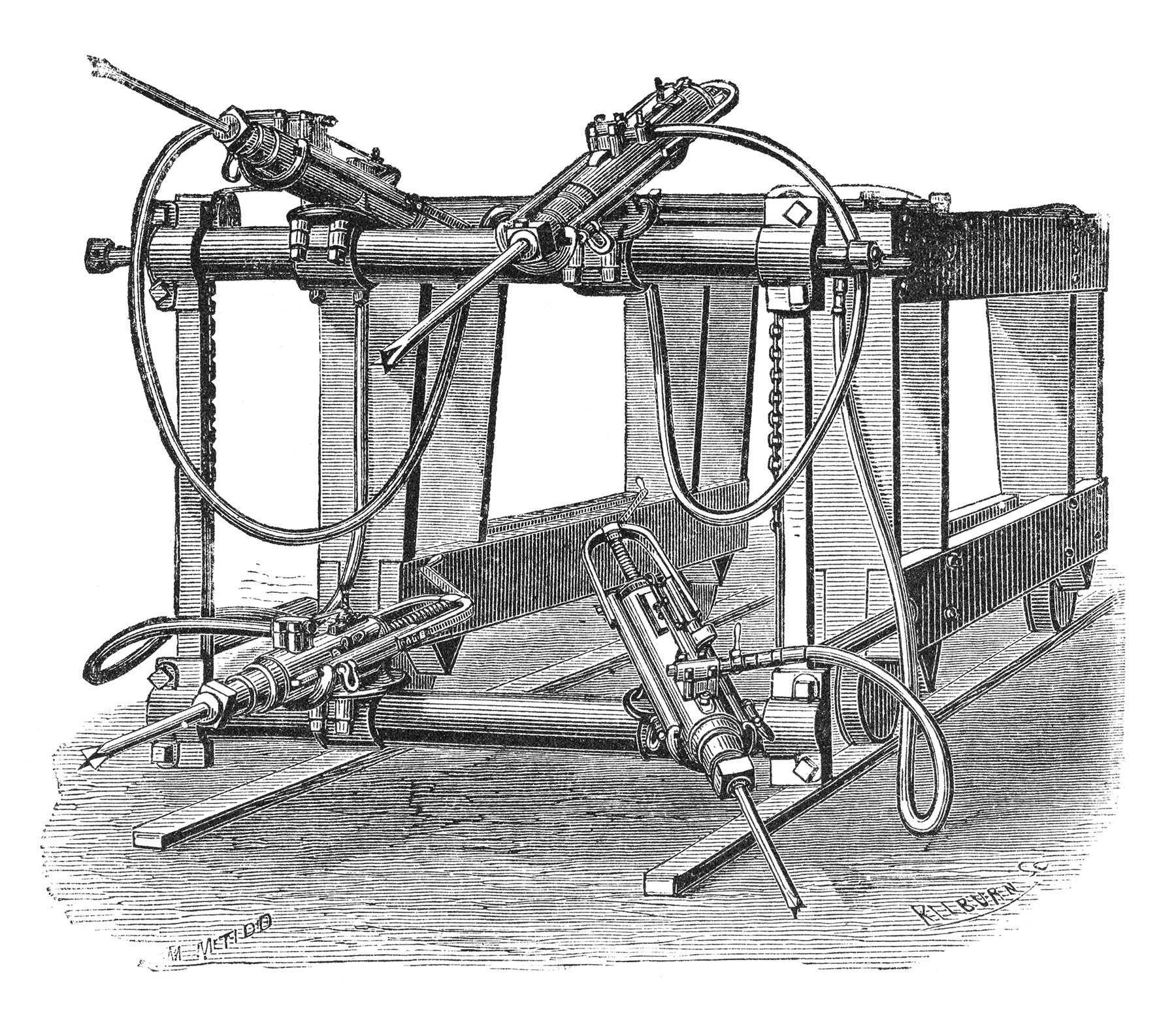 Image shows a machine on wooden rails. The machine has four arms that were used to blast through rock. 