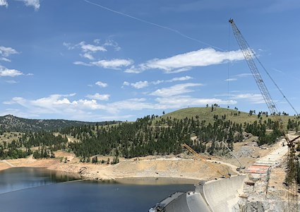 construction crews work on the dam