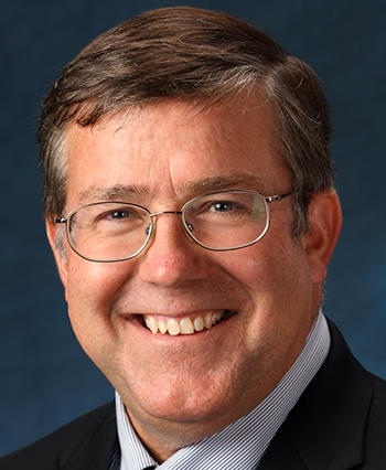 Man smiles for the camera