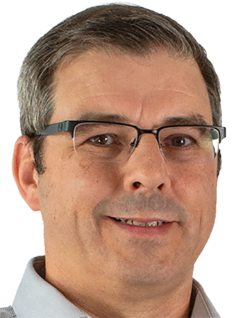 image of man wearing glasses smiling for camera