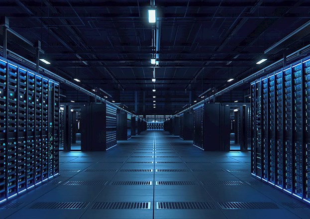Rows of servers, bathed in blue light, stand ready to support the digital world.
